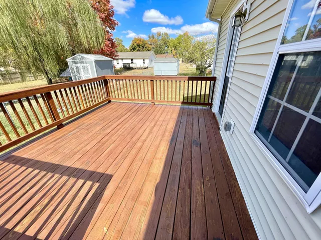 a view of balcony with wooden floor