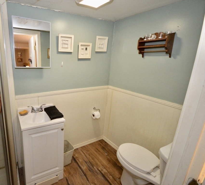 720 Kearsarge Road Conway, NH 03845 - Photo 20 of 21 a bathroom with a toilet a sink and a mirror