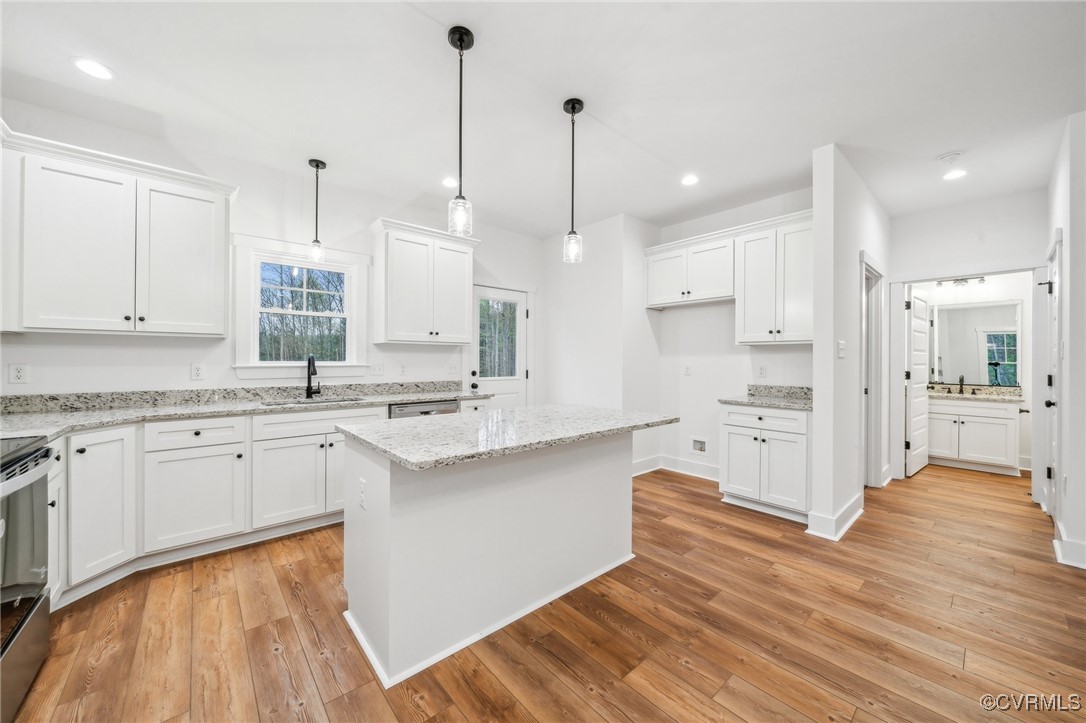 2467 Judes Ferry Road Powhatan, VA 23139 - Photo 11 of 36 a large kitchen with kitchen island a sink stainless steel appliances and cabinets