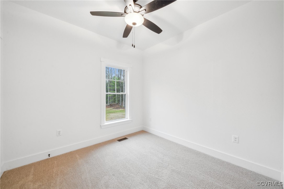 2467 Judes Ferry Road Powhatan, VA 23139 - Photo 14 of 36 an empty room with a window and a fan