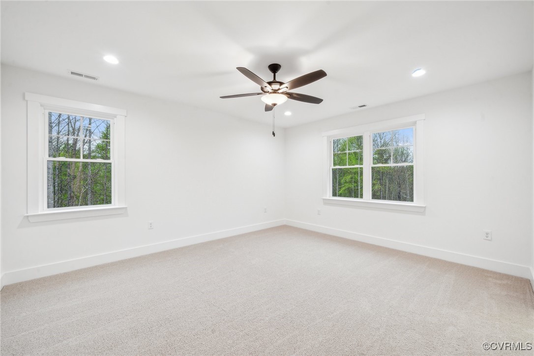 2467 Judes Ferry Road Powhatan, VA 23139 - Photo 20 of 36 an empty room with a window and a ceiling fan