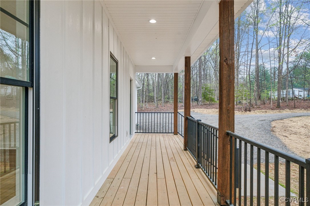 2467 Judes Ferry Road Powhatan, VA 23139 - Photo 4 of 36 a view of a balcony with wooden floor