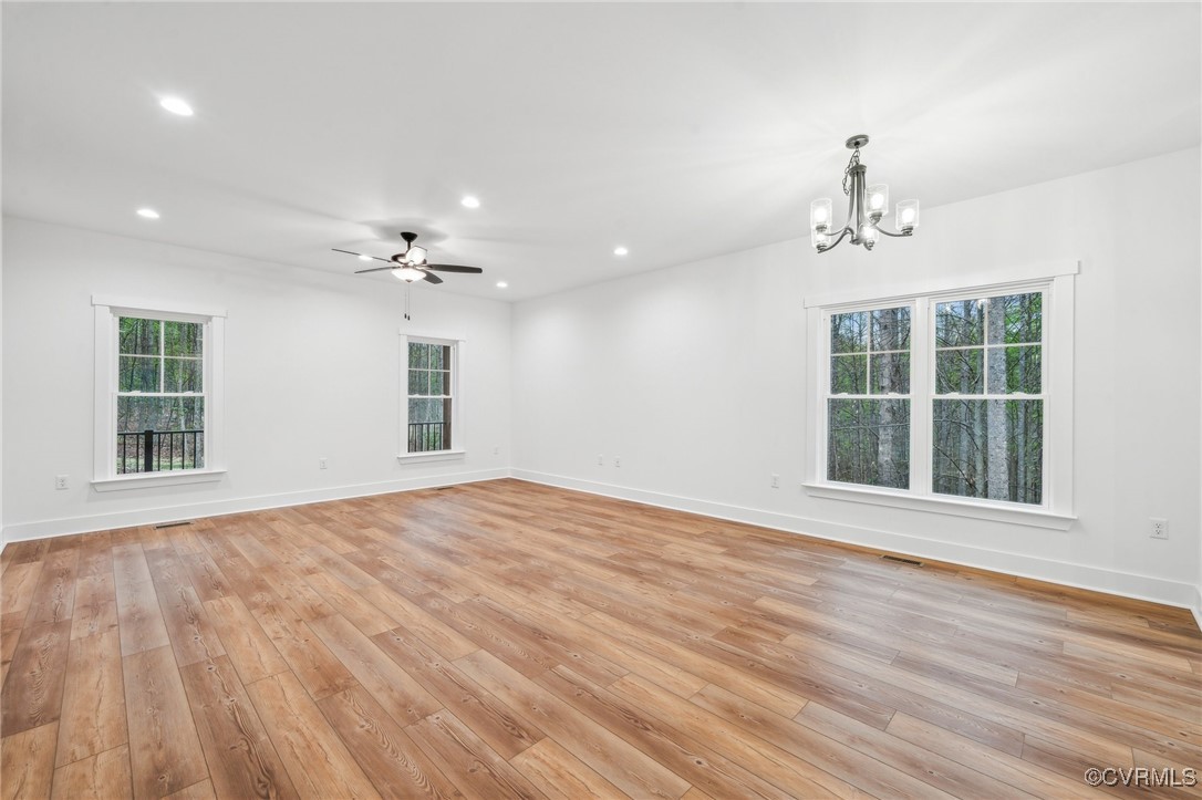 2467 Judes Ferry Road Powhatan, VA 23139 - Photo 7 of 36 a view of an empty room with a window and wooden floor