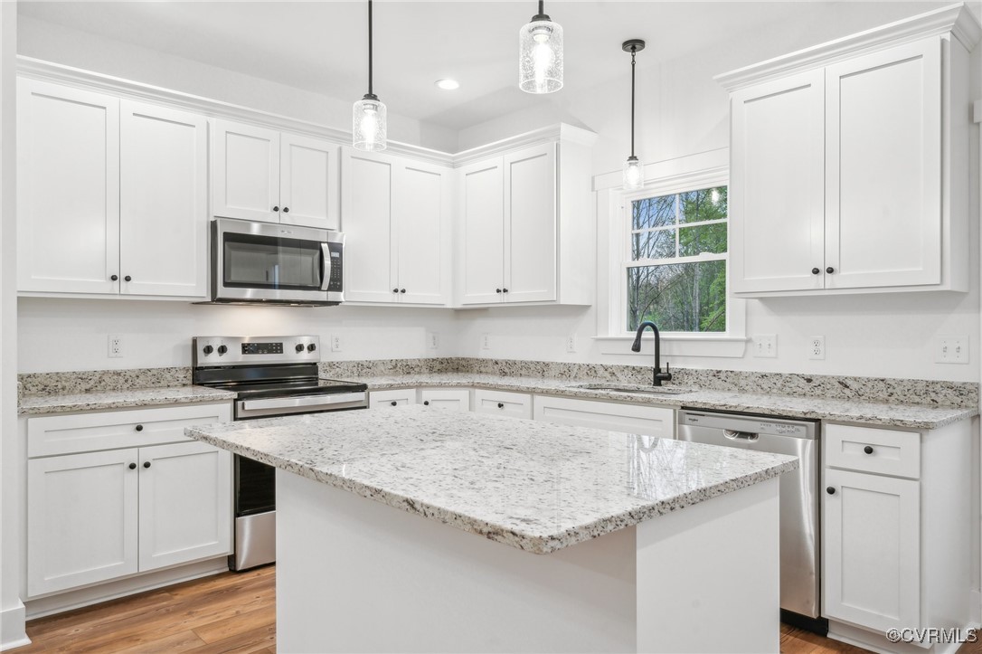 2467 Judes Ferry Road Powhatan, VA 23139 - Photo 8 of 36 a kitchen with granite countertop cabinets stainless steel appliances a sink and a window