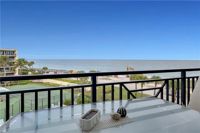 a kitchen with granite countertop cabinets stainless steel appliances and a sink