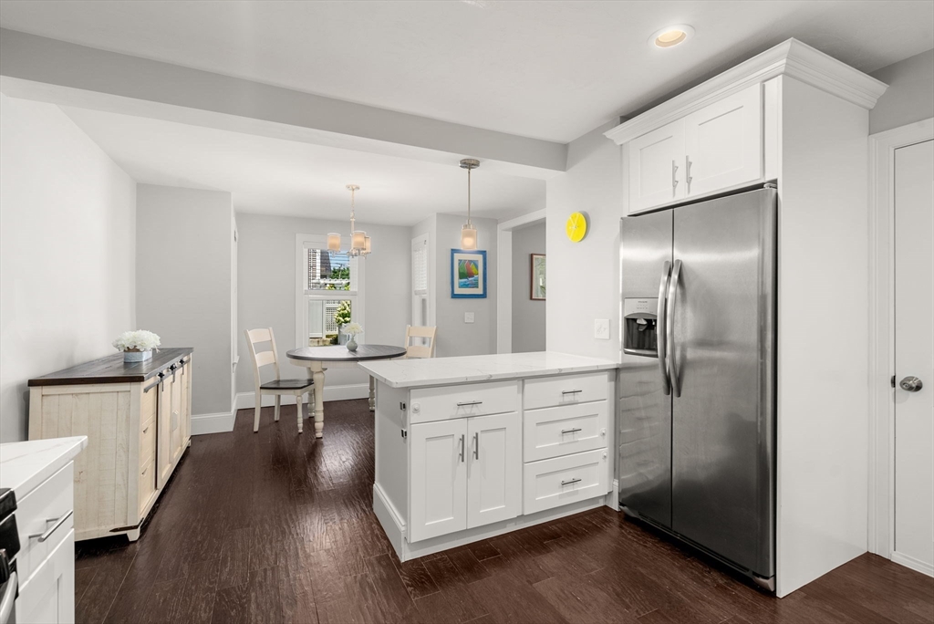 68 Prospect Street Canton, MA 02021 - Photo 10 of 28 a kitchen with stainless steel appliances a refrigerator sink and wooden floor