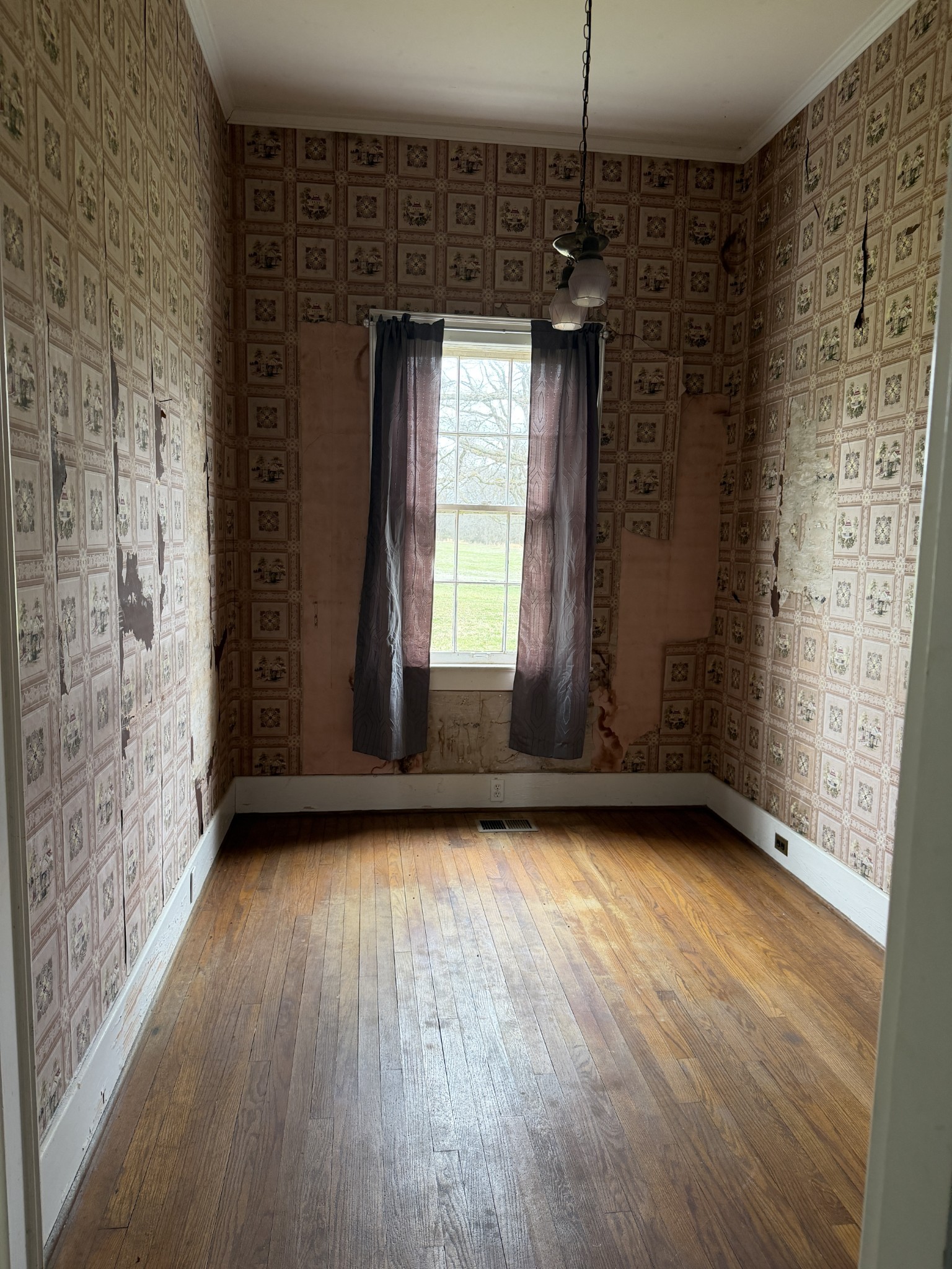 3138 Richmond Road Petersburg, TN 37144 - Photo 15 of 41 a view of an empty room with wooden floor and a window