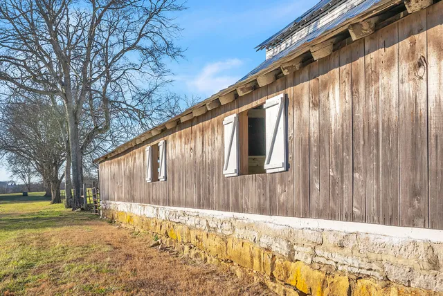 view of a house with a backyard