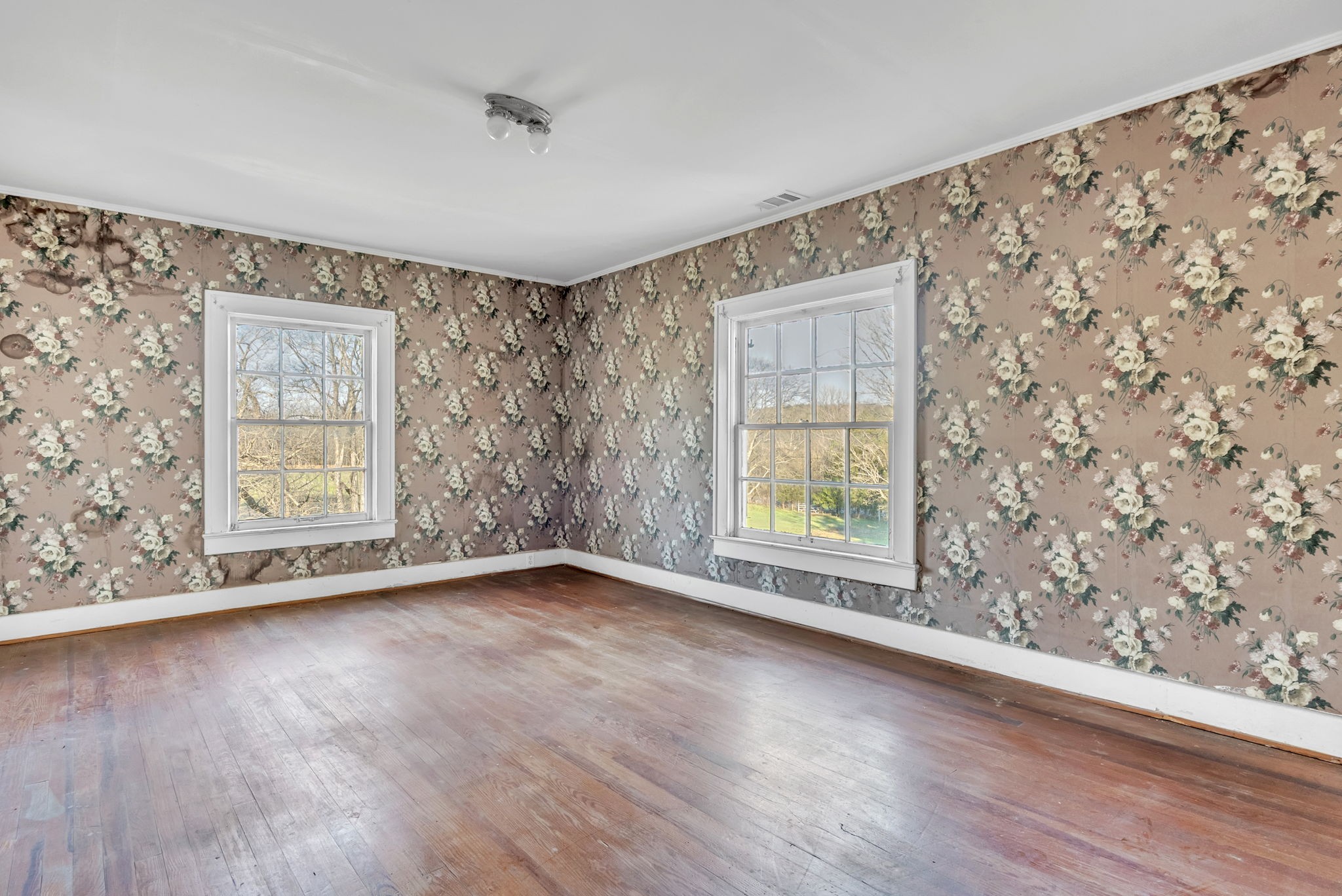 3138 Richmond Road Petersburg, TN 37144 - Photo 9 of 41 an empty room with wooden floor and windows