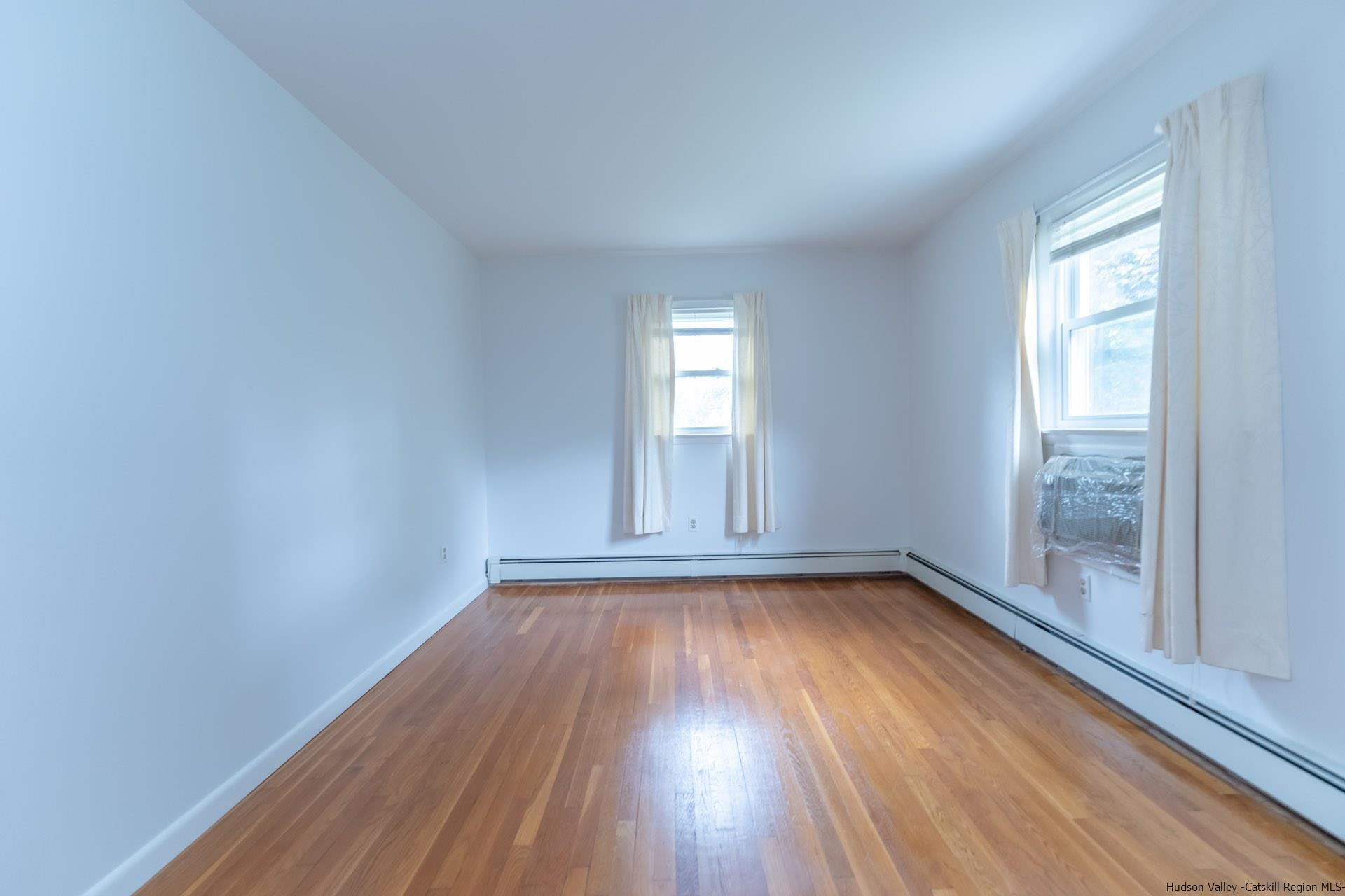 2 Magic Drive Kingston, NY 12401 - Photo 23 of 27 a view of an empty room with wooden floor and a window