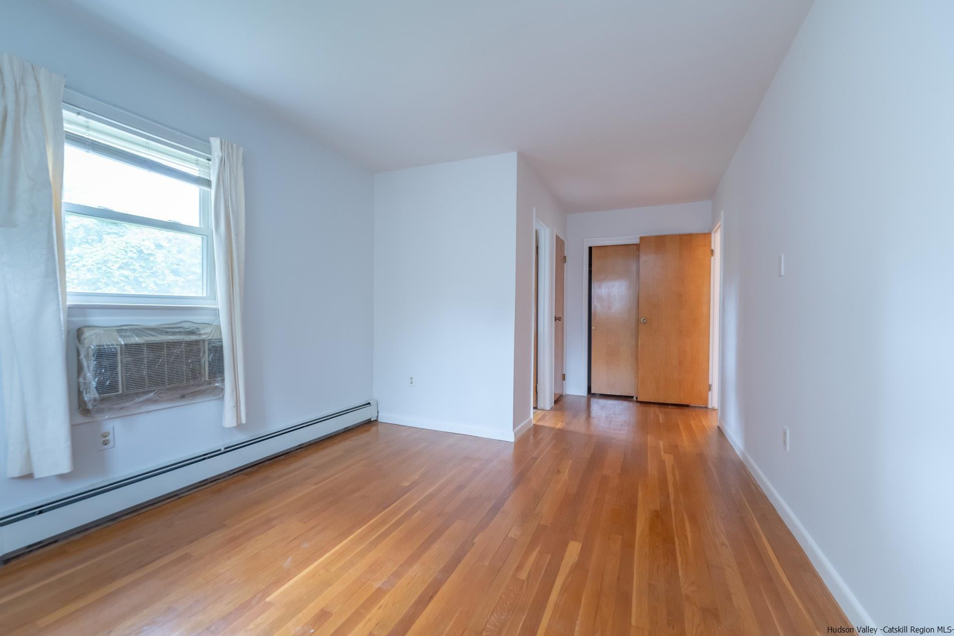 2 Magic Drive Kingston, NY 12401 - Photo 24 of 27 a view of an empty room with wooden floor and a window