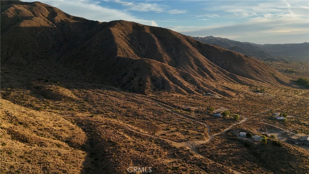 49680 Oskar Lane Morongo Valley, CA 92256 - Photo 9 of 10 a view of a house with a yard