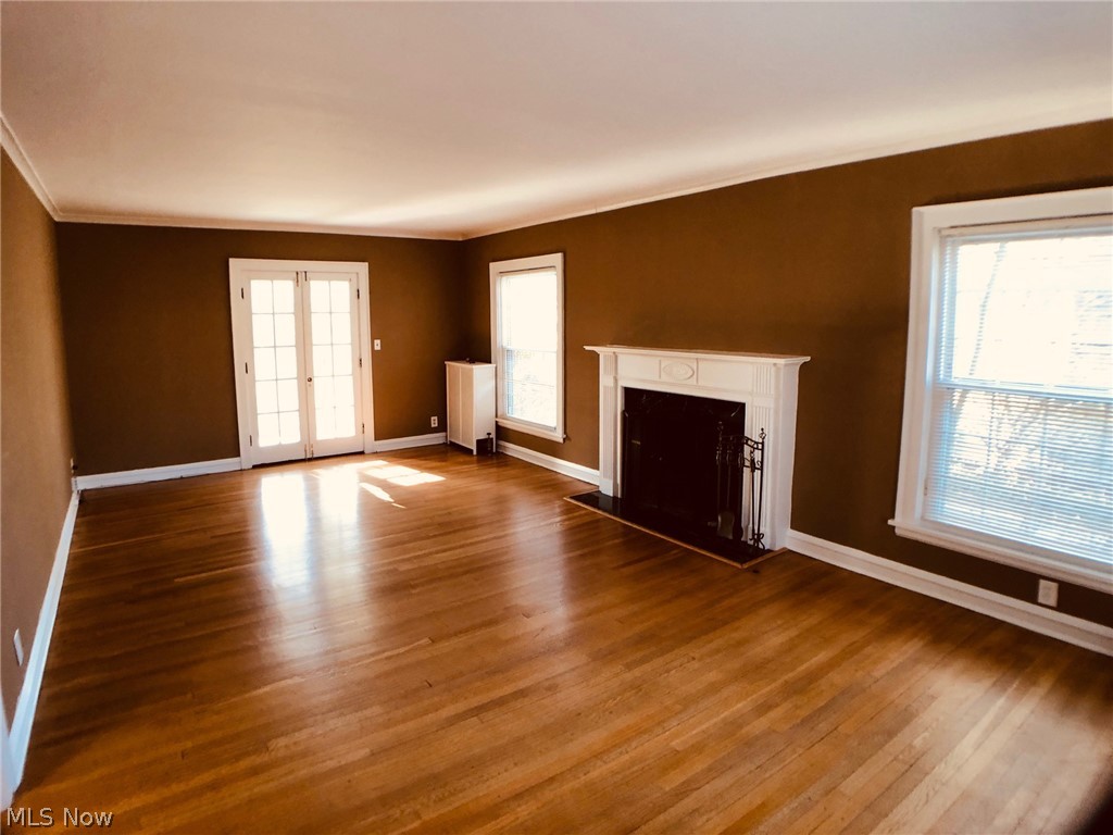3330 Elsmere Road Cleveland, OH 44120 - Photo 2 of 35 Expansive living room with fireplace and hardwood floors