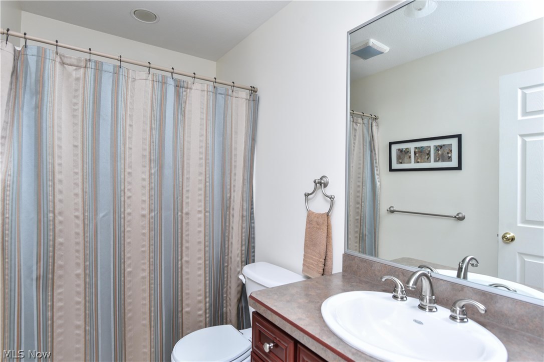 603 South Raccoon Road, Unit 52 Youngstown, OH 44515 - Photo 15 of 29 The guest bathroom includes a tub shower and a single vanity.