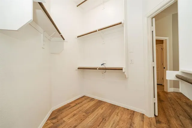 a view of small space with wooden floor and staircase