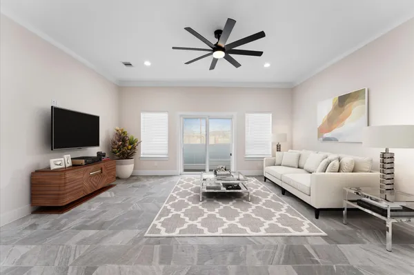 an empty room with a ceiling fan and window