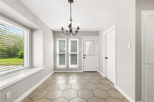 a view of a room with windows