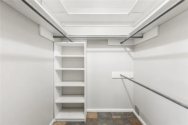 a view of an empty walk in closet