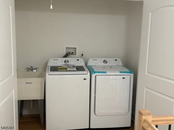 a utility room with dryer and washer