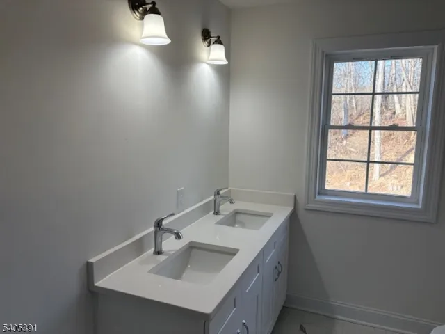 a bathroom with a sink and a vanity