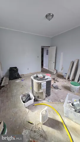 a dining room with a stove and a wooden floor