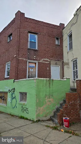 a front view of a building with garden