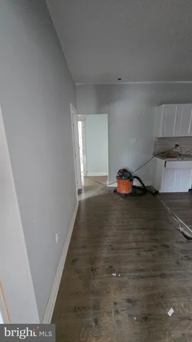 a hallway with a view of bedroom