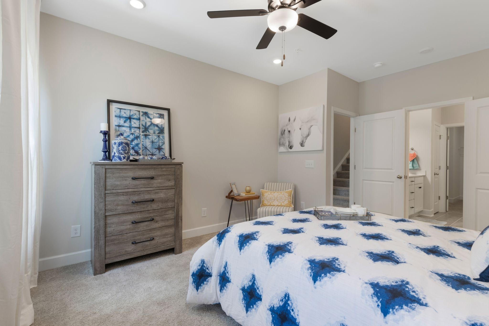 1092 June Wilde Ridge Spring Hill, TN 37174 - Photo 12 of 32 a bedroom with a bed and a chandelier