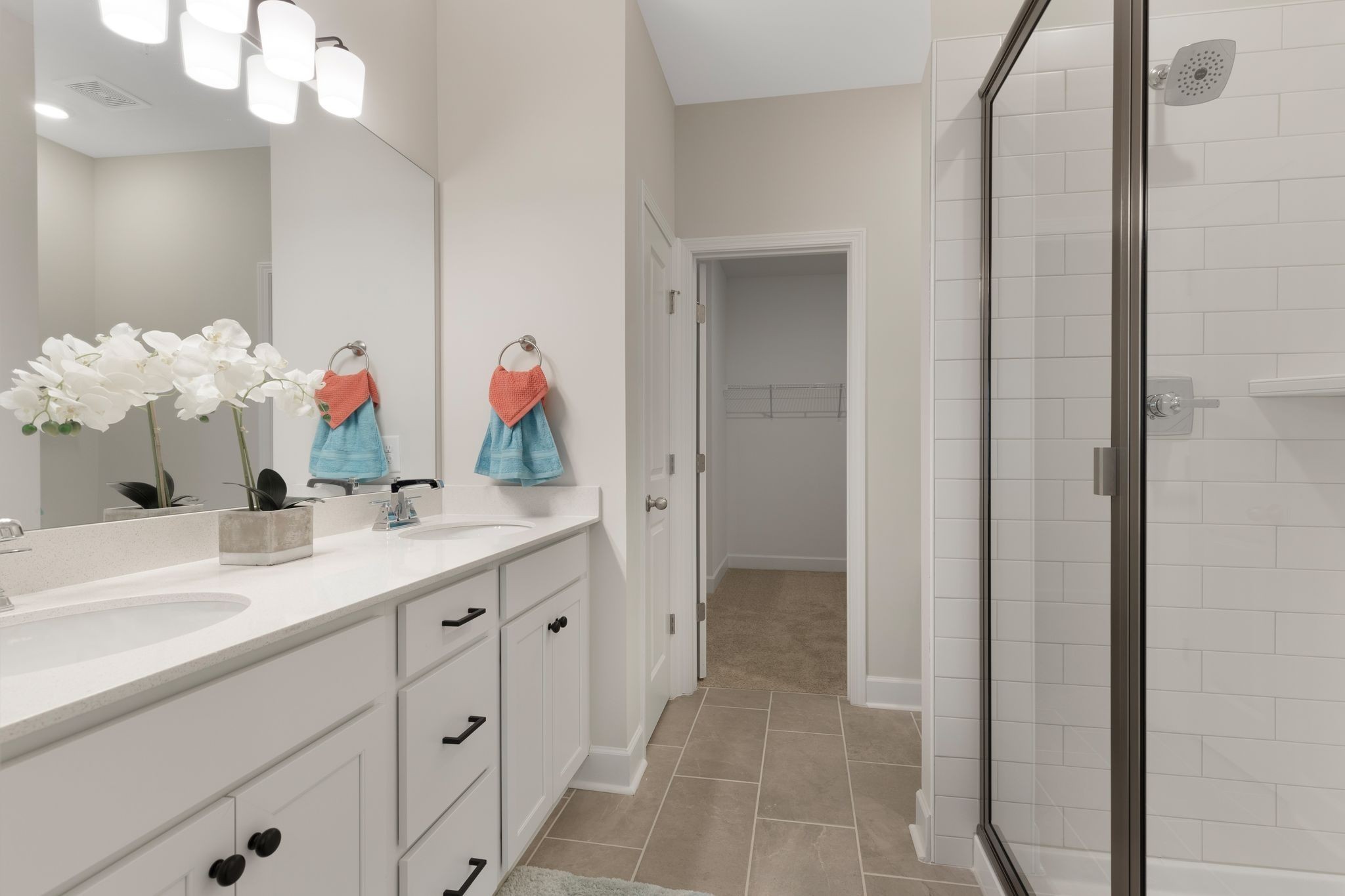 1092 June Wilde Ridge Spring Hill, TN 37174 - Photo 13 of 32 a bathroom with a double vanity sink mirror and next to a window