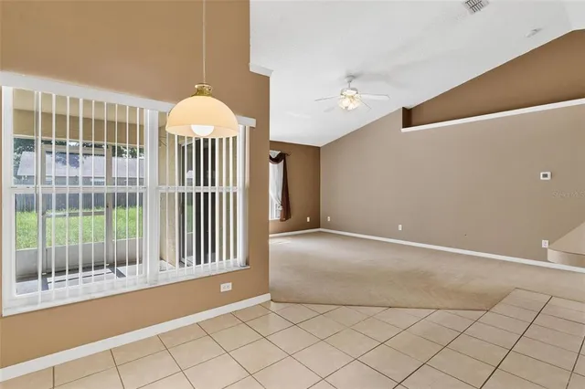 a view of a big room with a kitchen