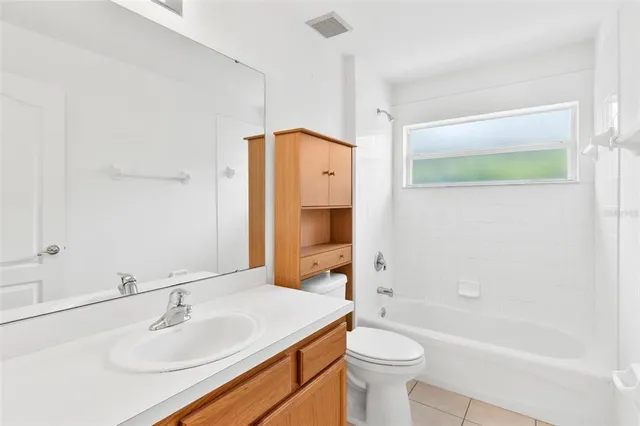 a view of an empty room and a window