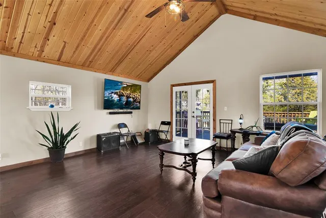 a view of a balcony with wooden floor and fence