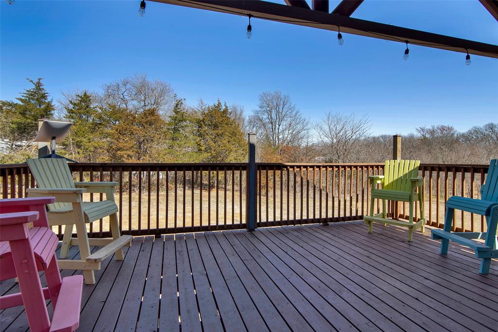 263 Esquire Drive Denison, TX 75021 - Photo 12 of 38 a view of a balcony with wooden floor and fence