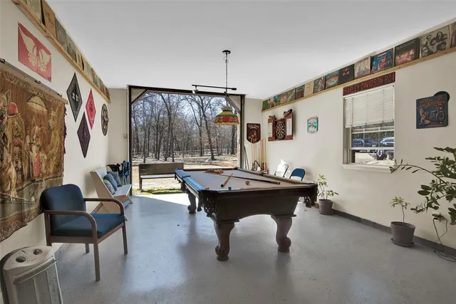 a view of a living room with table tennis and a table