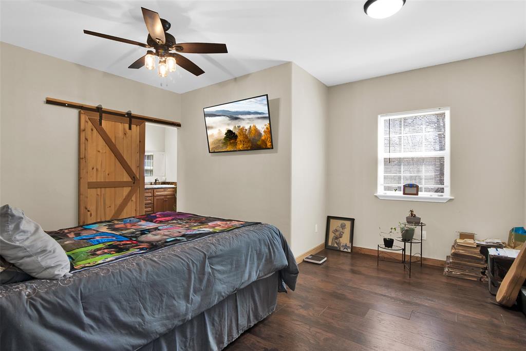 263 Esquire Drive Denison, TX 75021 - Photo 22 of 38 a bedroom that has a bed and a window