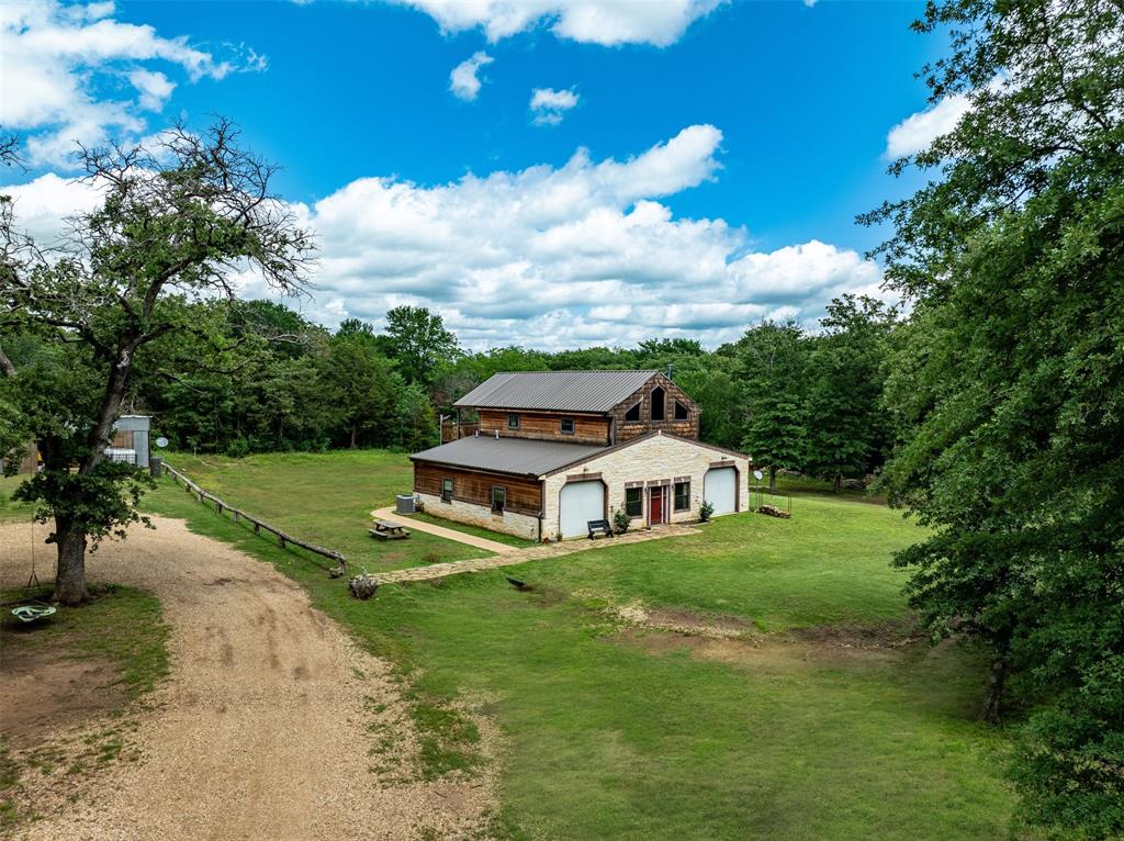 263 Esquire Drive Denison, TX 75021 - Photo 4 of 38 a swimming pool with trees in the background