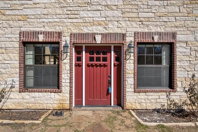 a view of a room with wooden floor and stairs