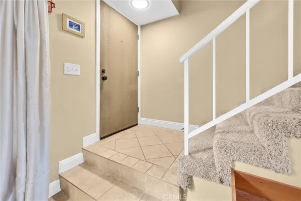 a view of a hallway to rooms