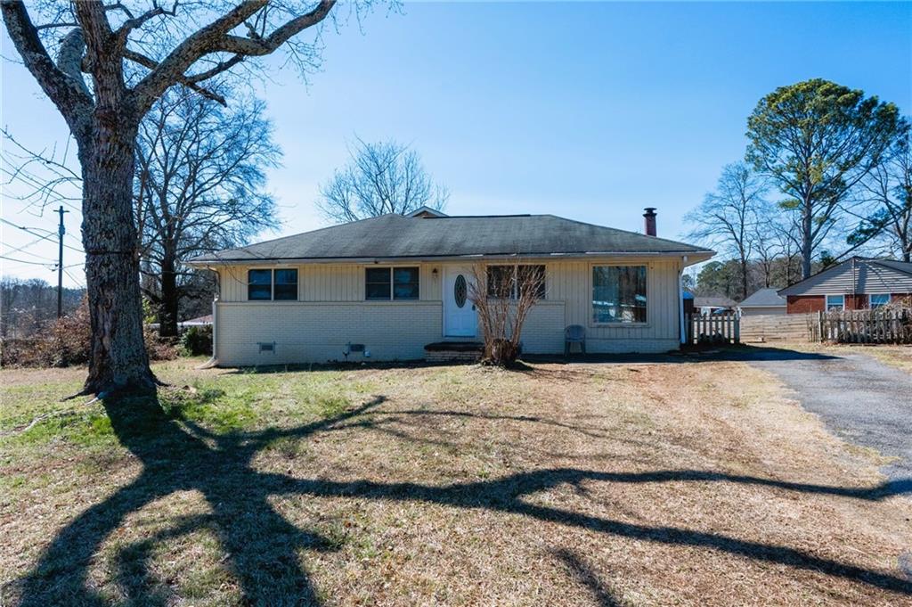 195 Rocking Hill Drive Southwest Marietta, GA 30060 - Photo 1 of 1 a front view of a house with a yard