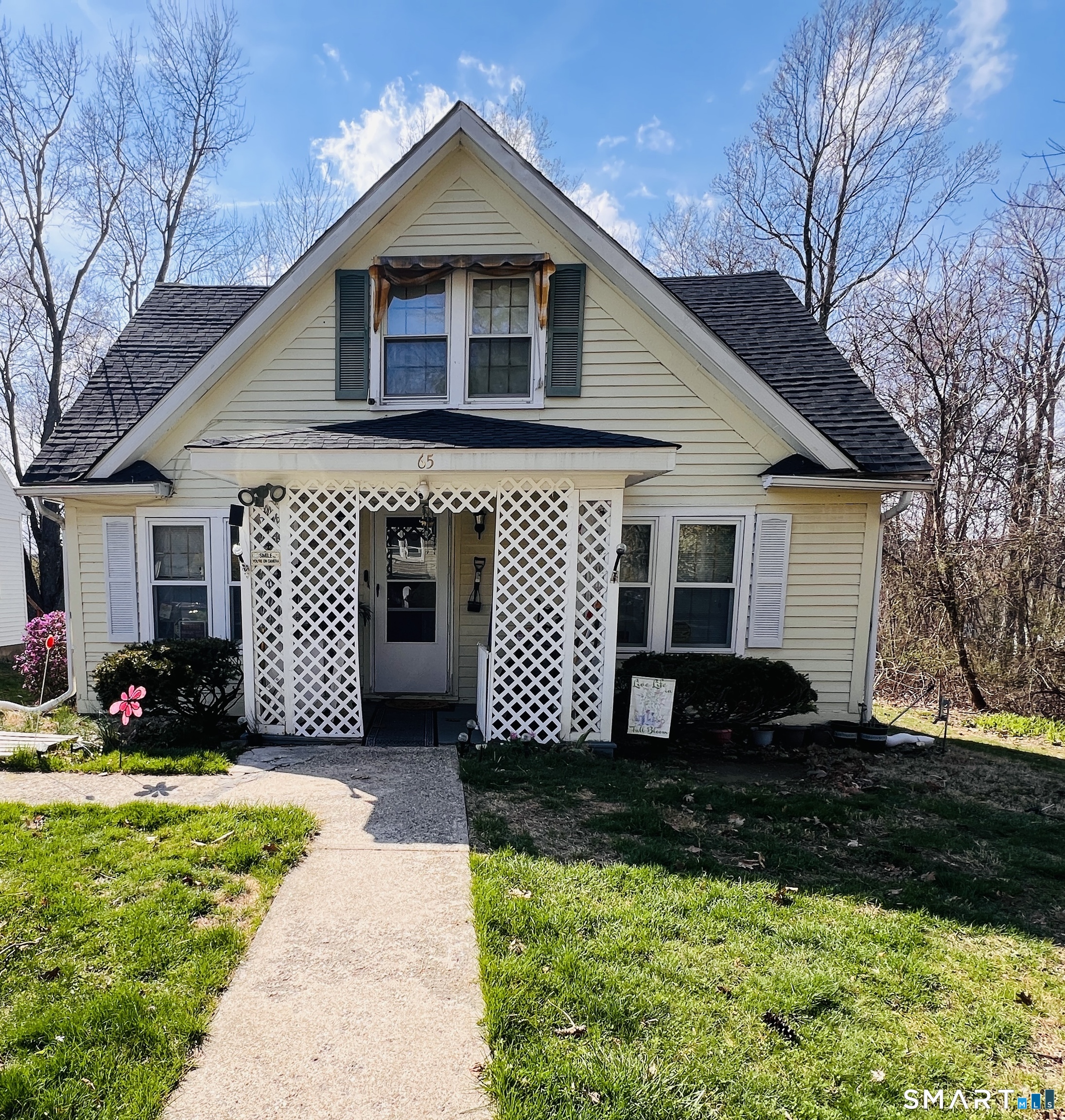 a front view of a house with a yard