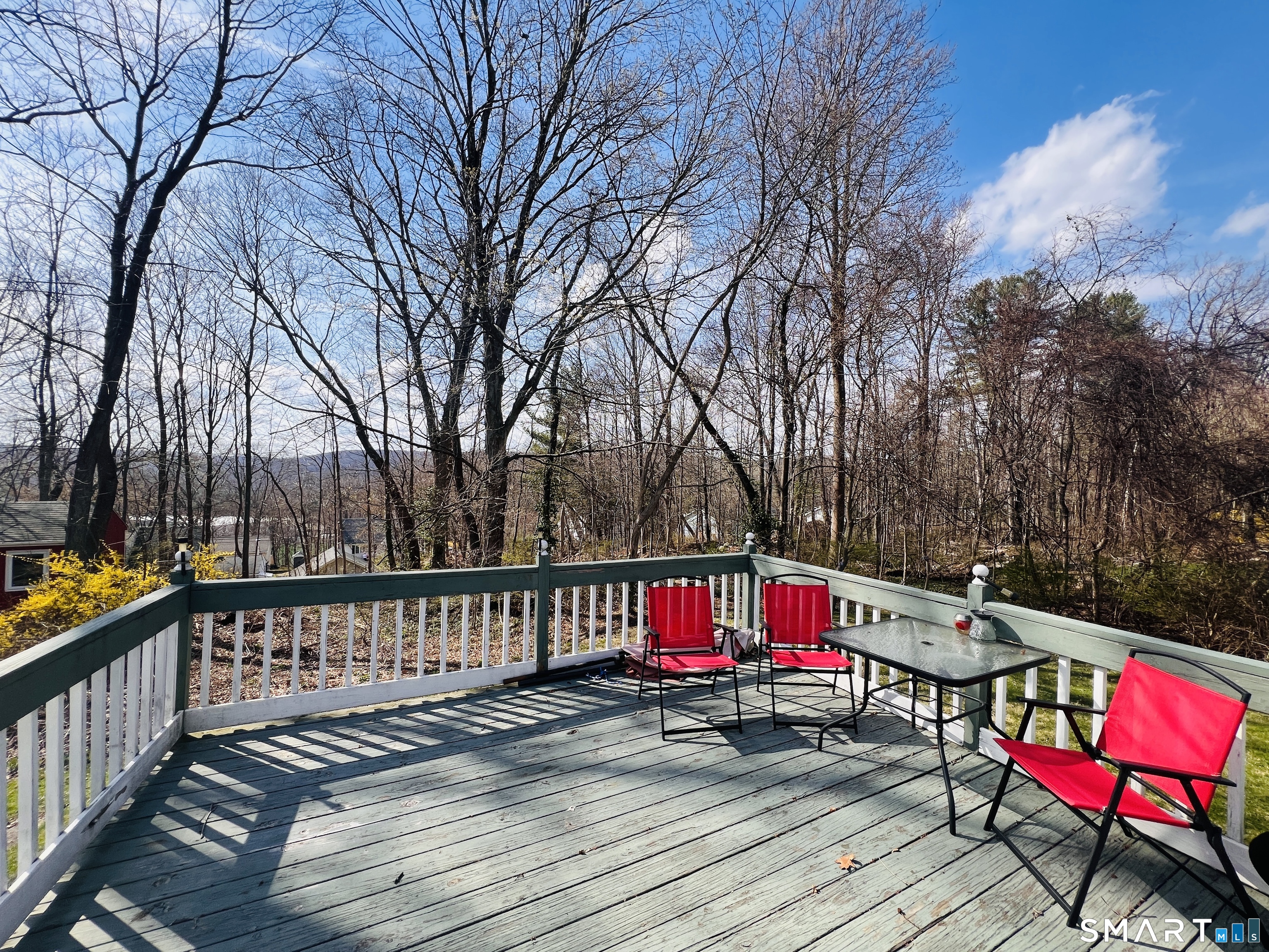 65 Garden Street Torrington, CT 06790 - Photo 4 of 5 a view of sitting area with trees and wooden fence