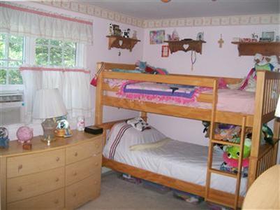 274 Simon Narrows Road Mashpee, MA 02649 - Photo 12 of 28 a bedroom with a bed and window