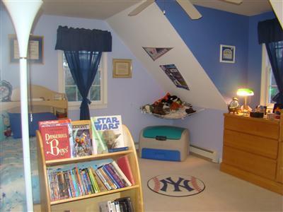 274 Simon Narrows Road Mashpee, MA 02649 - Photo 13 of 28 a picture of a living room with furniture and a book shelf