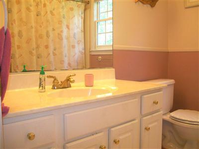 274 Simon Narrows Road Mashpee, MA 02649 - Photo 16 of 28 a bathroom with a sink and a toilet