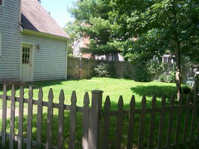 274 Simon Narrows Road Mashpee, MA 02649 - Photo 22 of 28 a view of a white house with a big yard