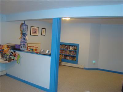 274 Simon Narrows Road Mashpee, MA 02649 - Photo 25 of 28 a view of a hallway with painting on the wall and a potted plant