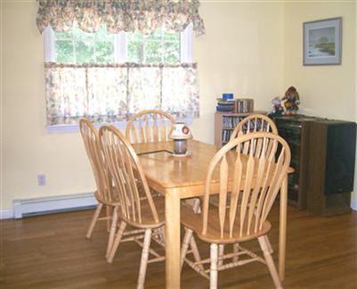 274 Simon Narrows Road Mashpee, MA 02649 - Photo 4 of 28 a view of a dining room with furniture and wooden floor