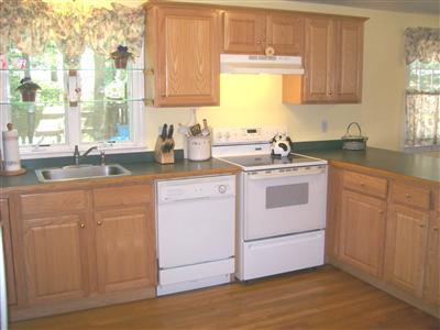 274 Simon Narrows Road Mashpee, MA 02649 - Photo 6 of 28 a kitchen with sink cabinets and window