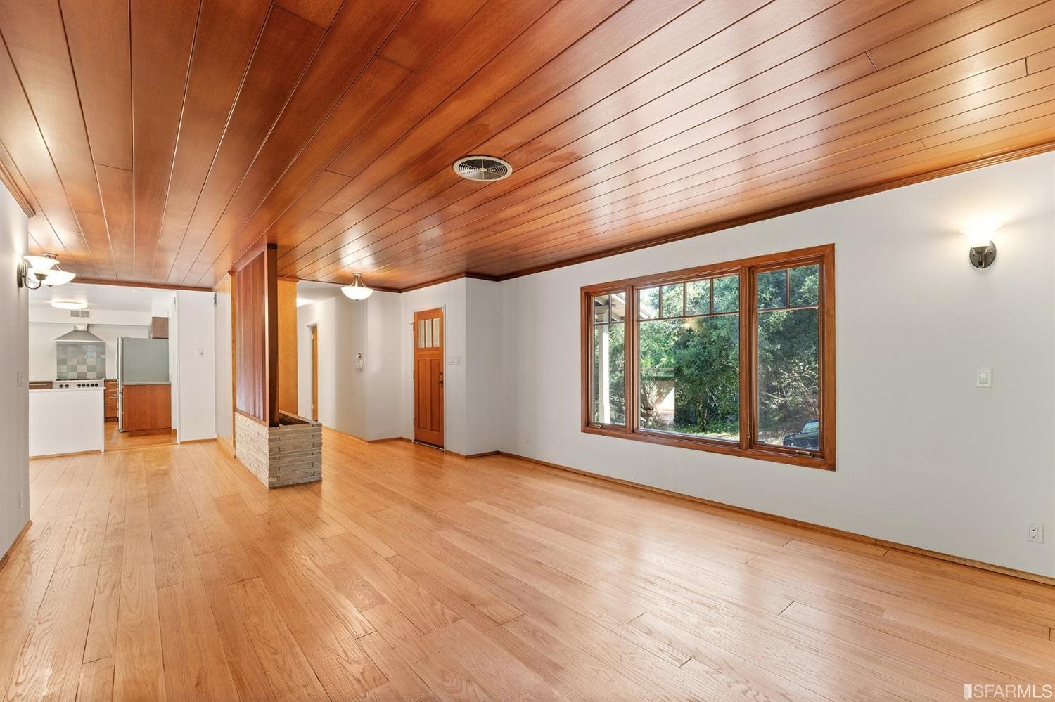 1180 Park Hills Road Berkeley, CA 94708 - Photo 12 of 62 a view of an empty room with wooden floor and a window