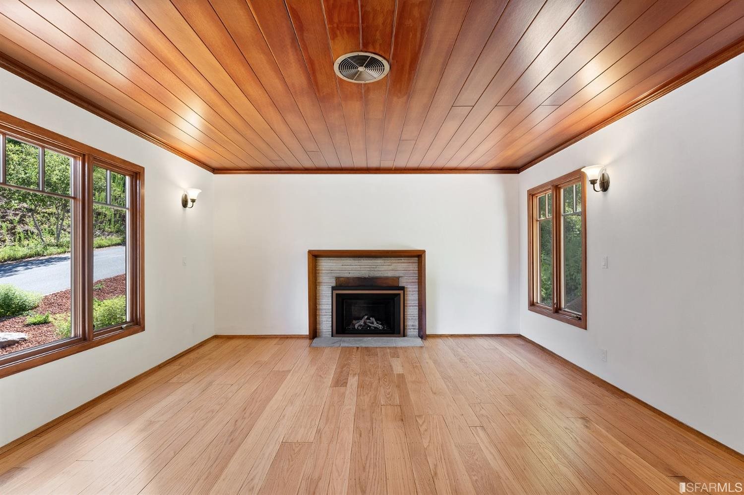 1180 Park Hills Road Berkeley, CA 94708 - Photo 18 of 62 a view of an empty room with wooden floor and a window